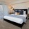 a bedroom with a large window