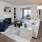 a large living area with plenty of natural light