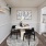 a dining area with art on the wall